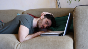 person asleep at computer
