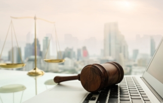 courtroom gavel on a laptop